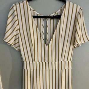 Never worn. White and mustard yellow. Super cute. Deep V.